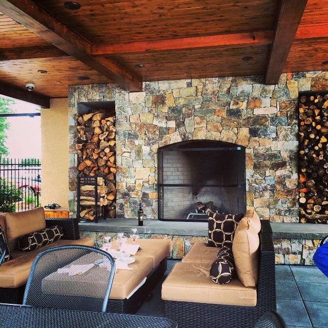 The makeover included an outdoor seating area next to an inviting fireplace. 